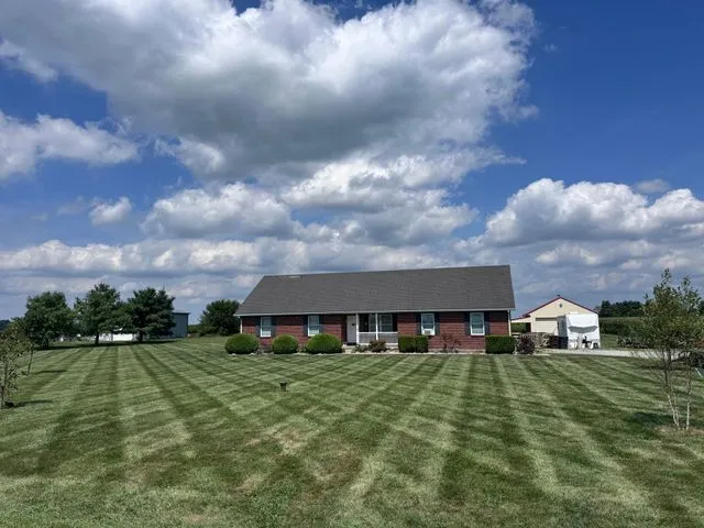 Manicured backyard lawn maintained by 5 Points